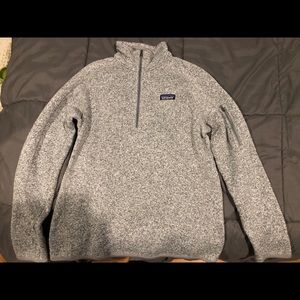 woman’s grey 1/4 zip up fleece